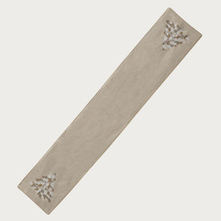 Close-up of cream beaded Christmas tree table runner with gold and silver bead detailing on neutral holiday table setting – sophisticated 70-inch holiday runner for Christmas dining or buffet styling.