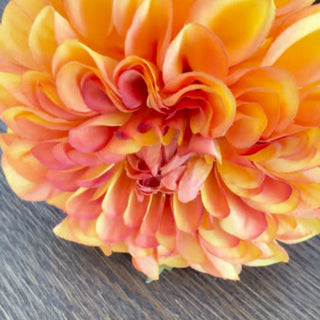 Close up video of the 29-inch sunset orange faux dahlia stem with ombré petals.