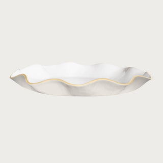 cream and white round serving tray with scalloped edge and gold trim styled for pastries or centerpiece display