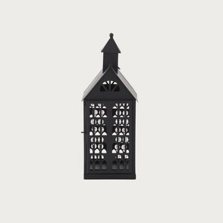 Decorative black metal accent house with cutout windows for seasonal décor