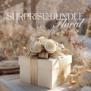 Decorative floral arrangement on a gift box with 'Surprise Bundle Floral' text.