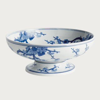 Blue and white Chinoiserie footed ceramic bowl featuring a classic botanical pattern on a crisp white base. A timeless spring decor accent ideal for dining tables, kitchen islands, consoles, shelves, and thoughtfully styled interiors.