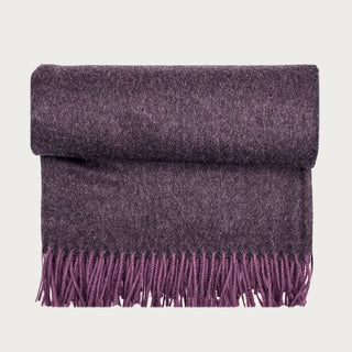 Rolled Elderberry 100% baby alpaca throw blanket with deep muted plum coloring, soft woven texture, and coordinating fringe.