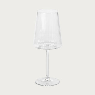 Set of 4 fluted wine glasses, clear glass with textured ridges on a cream colored background by Third & Main