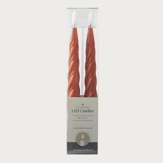 Ember Spiral LED Taper Candles shown in packaging as a set of two with wax spiral design, flickering LED flame, and timer feature.