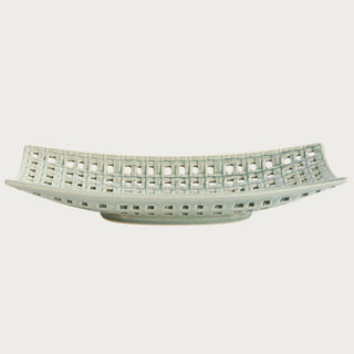 Rectangular woven ceramic tray with open lattice design and soft neutral glaze, styled as an elegant decorative accent