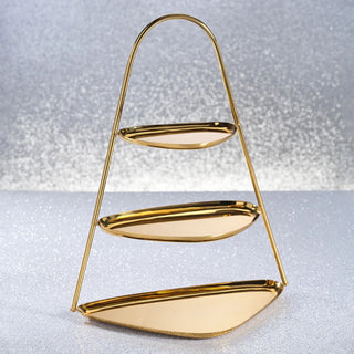 Three-tiered gold display stand with arched frame and mirrored shelves, perfect for elegant entertaining, holiday displays, or modern home décor styling. Third & Main, Home Decor, Holiday Entertaining, Holiday Decor, Winter Decor, Luxury Decor, Contemporary Decor, Polished Gold