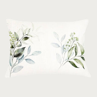 Eucalyptus botanical lumbar pillow with soft greenery design and neutral fabric, styled as a calming decorative accent
