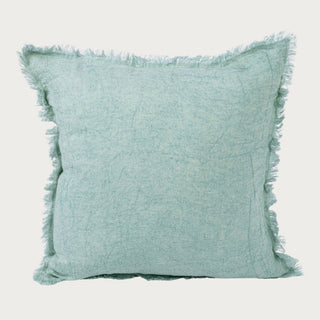 Eucalyptus mist linen pillow with soft fringe trim and relaxed texture, styled as a light and airy decorative accent