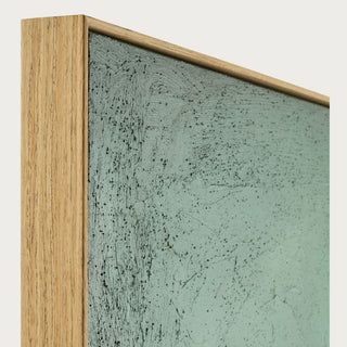 Close-up of the Evergreen Horizon canvas showing textured green brushwork and the slim natural brown frame.
