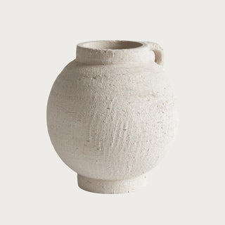 natural white terracotta amphora style vase with handles styled on console table with neutral decor