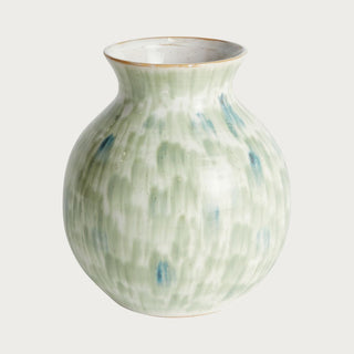 Green stoneware vase with soft blue undertones and rounded organic shape, styled as a sculptural decorative accent