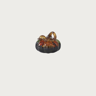 3 Inch Green & Amber Glass Pumpkin with a rounded glass body, deep green and warm amber color variation, reflective finish, and sculptural glass stem for fall decor.