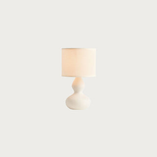 Illuminated gracie mini lamp with linen shade style don a neural background