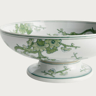 Green and white Chinoiserie footed ceramic bowl featuring a soft botanical pattern on a crisp white base. A timeless yet fresh spring decor accent perfect for dining tables, consoles, kitchen islands, and curated shelf styling.