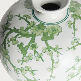 Green and white Chinoiserie ceramic vase with a soft botanical pattern on a crisp white base. A timeless spring decor accent perfect for styling consoles, shelves, dining tables, and entryways with faux florals or as a standalone statement piece.