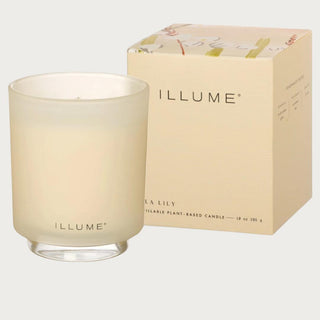 Isla Lily candle in glass jar with soft floral scent styled on table with neutral decor and warm natural light