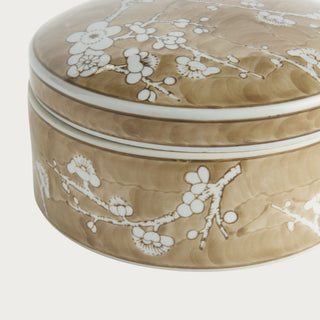 Close-up of the Large Brown Chinoiserie Empress Ceramic Box showing white flowering branches, layered warm brown glaze, and white trim around the lid.