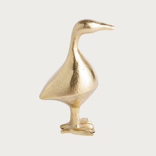Gold cast aluminum duck sculpture with textured finish and sculptural silhouette, styled as an elegant decorative accent