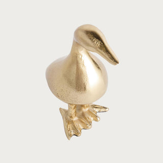 Gold cast aluminum duck sculpture with textured finish and sculptural silhouette, styled as an elegant decorative accent