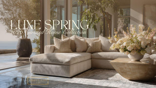 Luxury modern Malibu living room styled with the Luxe Curated Decor Collection from Third & Main, featuring sculptural neutral furniture, refined stone accents, and an elegant floral arrangement in natural light