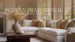 Elevated modern transitional living room evolved from modern farmhouse with an ivory sectional sofa, walnut coffee table, sculptural ceramic vase, and large windows filled with natural light