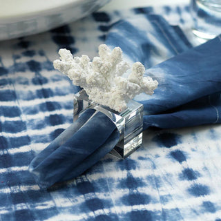 white coral inspired napkin rings with clear acrylic detail for coastal entertaining and elegant table styling