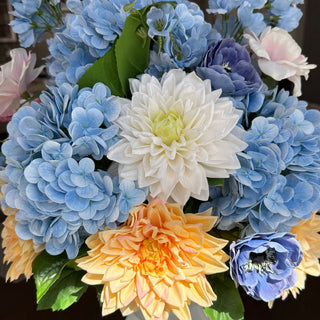 A close up photo of the Azure Garden Summer Premade Floral arrangement- vase not included. A summer modern farmhouse appropriate mix of blue, yellow, white and light pink blooms