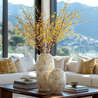 Mother of Pearl 19.5" high Decorative capraia vases with yellow aspen stems on a table in a living room with a mountain view.