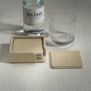 Set of 4 cream Napa leather coasters with matching tray, square drink coasters with textured finish and stitched edges, elegant tabletop accessory for coffee tables or home bars.