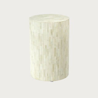 Natural bone inlay round stool with vertical textured pattern and cylindrical silhouette