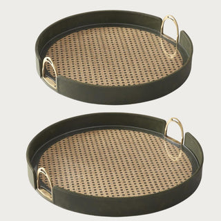 18-inch and 20-inch round decorative trays with olive green leather frames, natural woven rattan inlays, clear acrylic surfaces, and gold-tone handles.