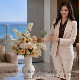 Petite Summer Conservatory faux floral bundle styled by Madi in a white vase, featuring faux white bougainvillea, real touch white orchids, creamy dahlias, creamy roses, and greenery for smaller vases up to 12 inches high, ideal for neutral summer home styling, bedside tables, bathroom vanities, and petite accent spaces.
