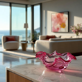 10 inch pink glass Abbie sculptural bowl styled on marble console in luxury Newport Beach modern contemporary living room with ocean view and large windows, styled home decor accent by Third & Main