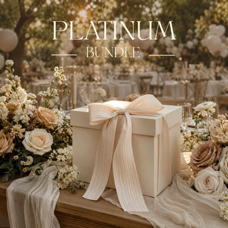 Large Gift Box sitting on a luxurious set table, with cream linens, fresh florals and a beautiful sunlit scene of california in the background.