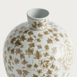 Close view of the Province Bottle Vase showing its ivory porcelain neck, warm taupe leaf pattern, fine botanical linework, and glazed finish.