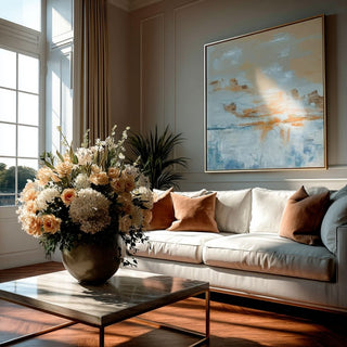 Quiet Horizon framed art print with soft horizon tones styled above a neutral sofa in a refined living room, shown in a gold frame by Third & Main