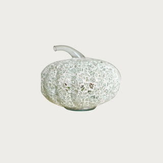 Gently Used Without Tags Glass Mosaic Pumpkin with Clear Stem by Pottery Barn- 6" High x 6.5" Wide. Good condition with some minor discoloring of the adhesive throughout and a small dent in the padded bottom. 