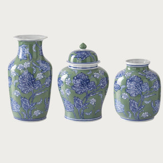 Three coordinating sage green, cobalt blue and white floral ceramic vases showing the large tall vase, medium lidded ginger jar, and small rounded vase.