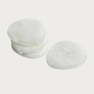White alabaster coaster, sold individually, natural stone veining detail ad semi gloss look. 