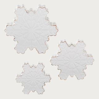 Set of 3 white dolomite tabletop snowflakes with embossed detailing and gold edges styled on black table — elegant winter and holiday home décor by Third & Main.”