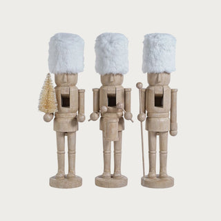 Set of three neutral resin nutcrackers with white faux fur hats — chic modern holiday décor with a touch of wit by Third & Main.