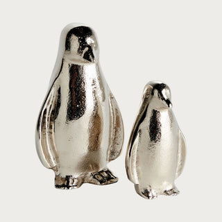 Set of two silver colored aluminum penguin figurines for home winter and holiday home decor