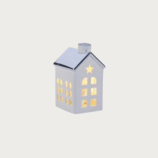 Set of two porcelain houses with platinum silver roofs — elegant glowing holiday décor in modern quiet luxury style by Third & Main.