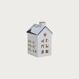 Set of two porcelain houses with platinum silver roofs — elegant glowing holiday décor in modern quiet luxury style by Third & Main.