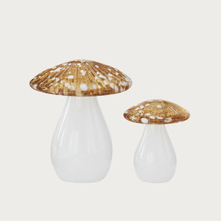 Set of 2 decorative yellow, gold and white handblown white glass mushrooms on  white background. 