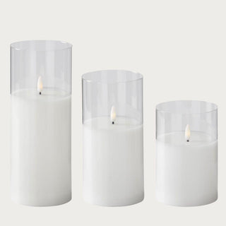 Set of tall, medium, and short white LED flameless candles with realistic flickering light in clear glass holders