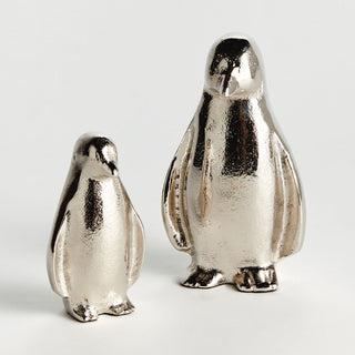 Set of two silver colored aluminum penguin figurines for home decor and holiday decor styling