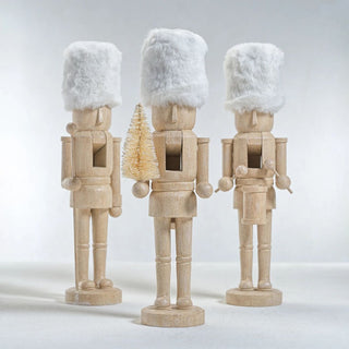 Set of three neutral resin nutcrackers with white faux fur hats — chic modern holiday décor with a touch of wit by Third & Main.