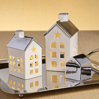 Set of two porcelain houses with platinum silver roofs — elegant glowing holiday décor in modern quiet luxury style by Third & Main.